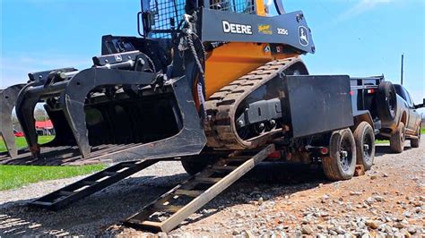 how to load a skid steer on a gooseneck trailer|skid steer pull on loading.